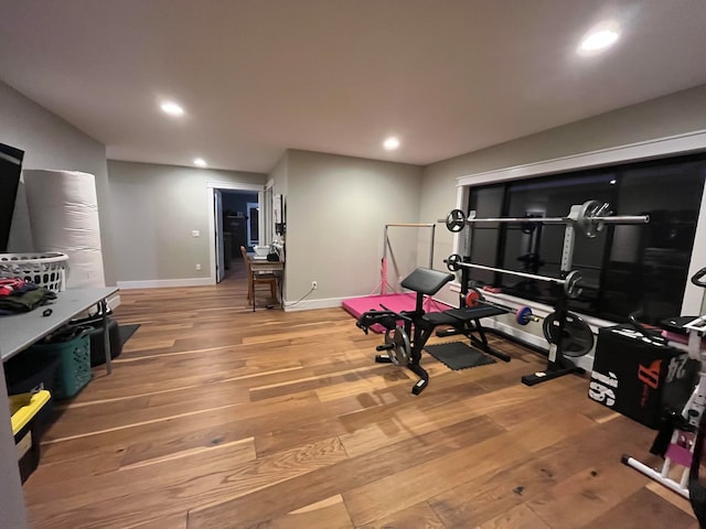 workout room with wood-type flooring