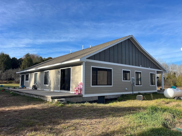 view of side of home featuring a lawn