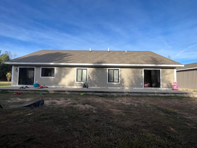 back of house with a patio area