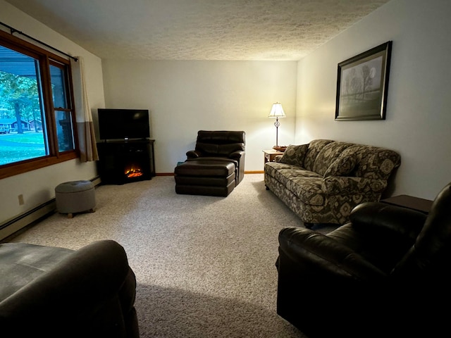 living room featuring carpet flooring, a textured ceiling, and a baseboard heating unit