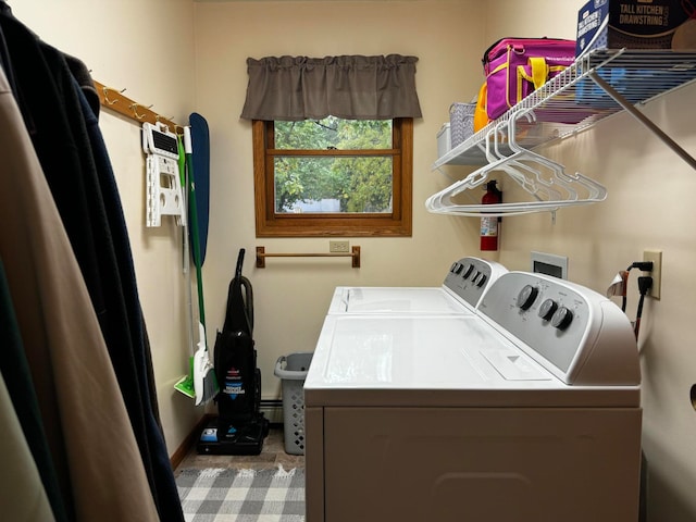 laundry area featuring washer and clothes dryer and a baseboard radiator