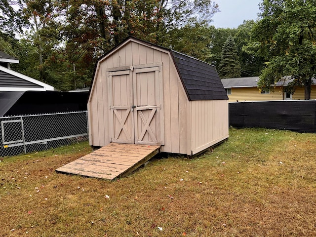 view of outdoor structure featuring a lawn