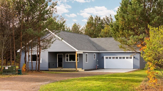 view of front facade with central air condition unit, a front lawn, a porch, and a garage