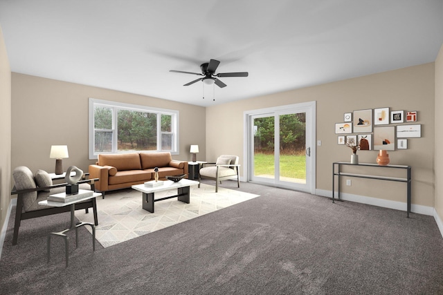 living room featuring light colored carpet, plenty of natural light, and ceiling fan