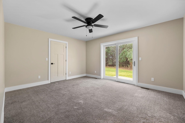 spare room with carpet flooring and ceiling fan