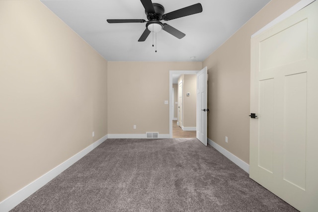 interior space with ceiling fan and carpet floors