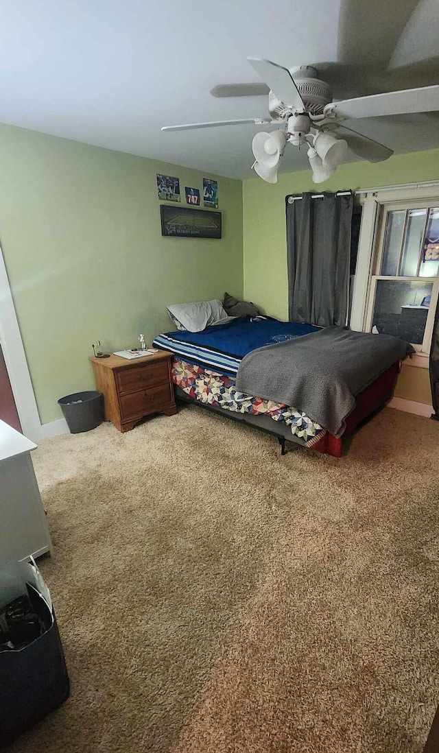 bedroom featuring ceiling fan and carpet flooring