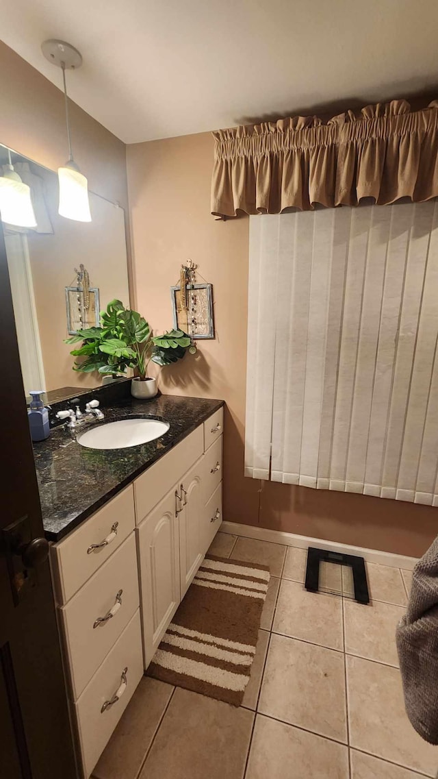 bathroom with tile patterned flooring and vanity