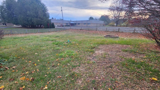 view of yard with an outdoor fire pit