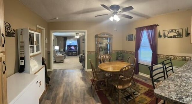 dining room featuring wood-type flooring and ceiling fan