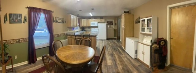 dining space featuring dark hardwood / wood-style flooring