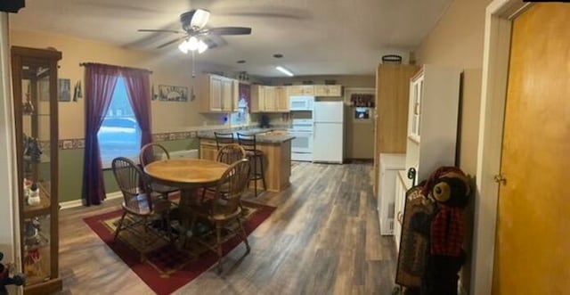 dining space featuring dark hardwood / wood-style floors and ceiling fan