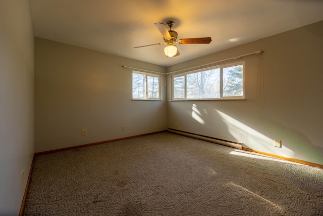 spare room featuring carpet floors, baseboard heating, and ceiling fan