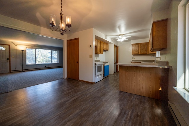 kitchen with sink, dark hardwood / wood-style floors, kitchen peninsula, white range with electric cooktop, and ceiling fan with notable chandelier