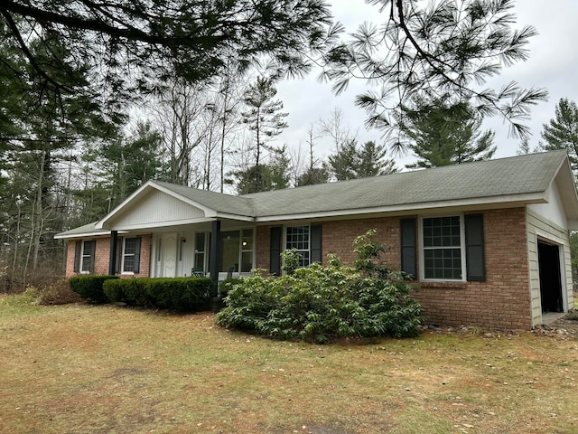 single story home with a front lawn and a garage