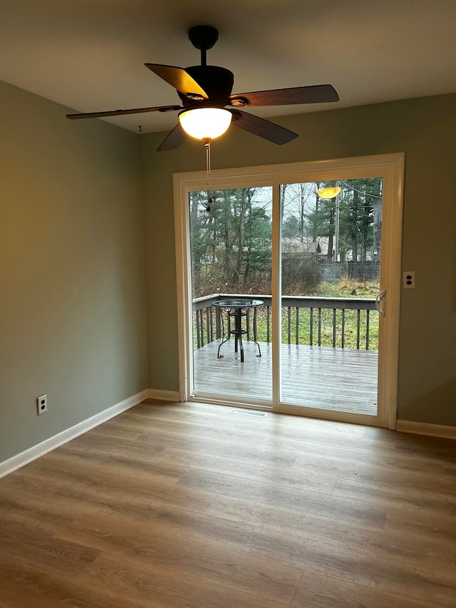 interior space with ceiling fan and hardwood / wood-style floors