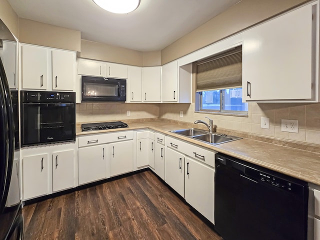 kitchen with black appliances, sink, dark hardwood / wood-style floors, tasteful backsplash, and white cabinetry