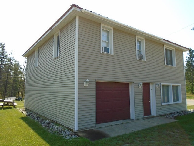 rear view of house featuring a garage