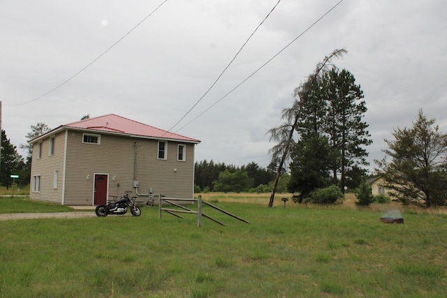 back of property with a yard