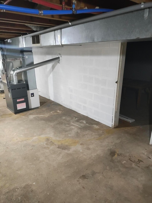 basement featuring heating unit