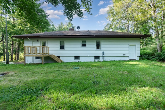 back of property with a lawn