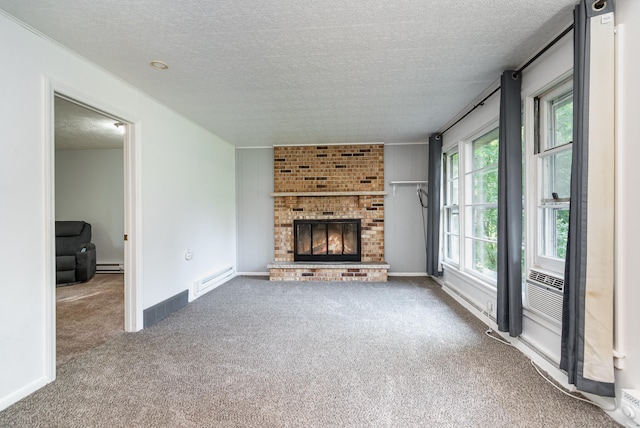 unfurnished living room featuring a textured ceiling, carpet floors, a fireplace, and a baseboard heating unit