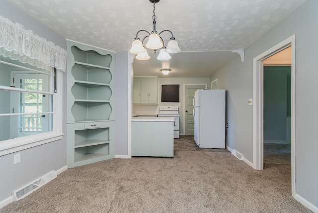 interior space with light carpet, white appliances, a textured ceiling, pendant lighting, and an inviting chandelier