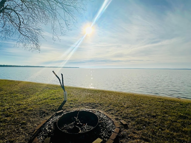 property view of water featuring a fire pit