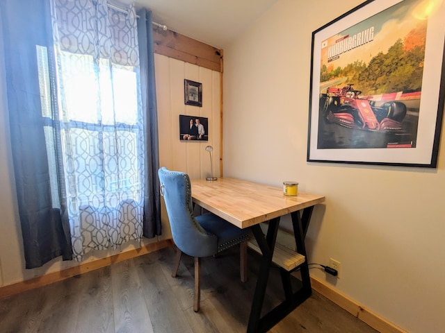 dining area featuring dark hardwood / wood-style floors