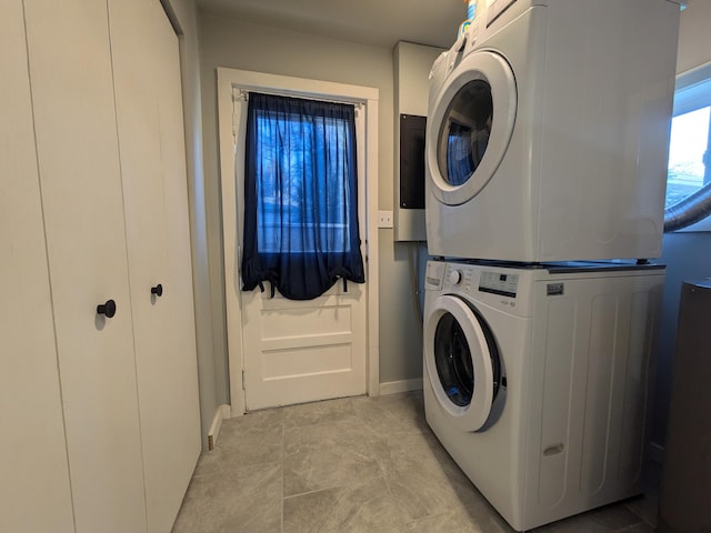 washroom featuring stacked washer and dryer