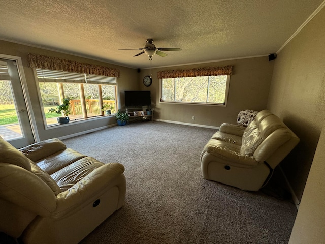 living room with crown molding, carpet floors, a textured ceiling, and ceiling fan