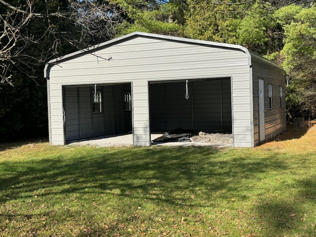 garage with a lawn