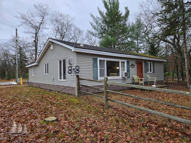 ranch-style house featuring cooling unit