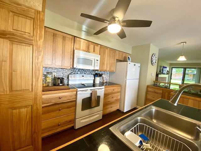 kitchen with ceiling fan, sink, dark hardwood / wood-style floors, backsplash, and white appliances