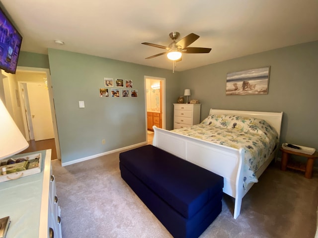 bedroom with connected bathroom, ceiling fan, and carpet floors