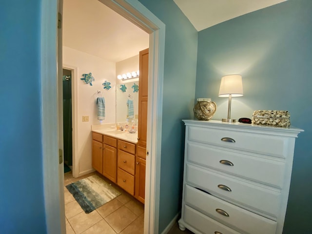 bathroom featuring tile patterned flooring and vanity