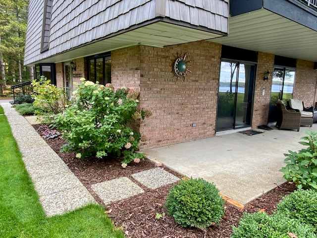 doorway to property with a patio area