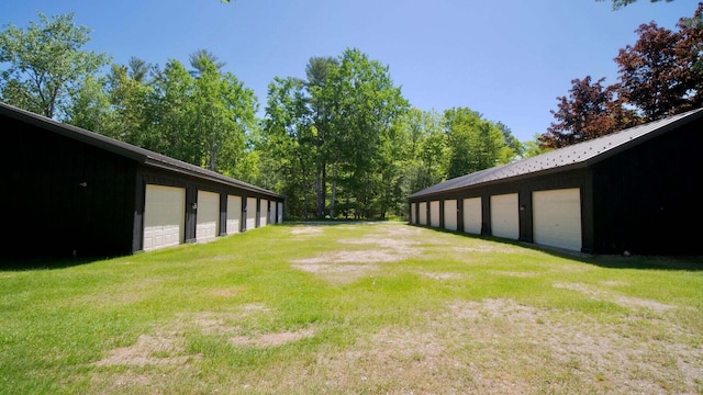 view of yard with an outbuilding and a garage