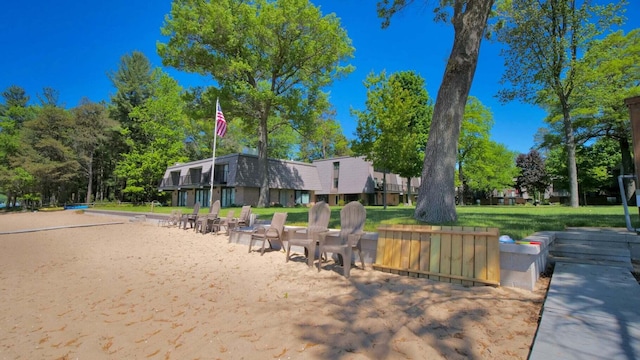 view of home's community with a lawn