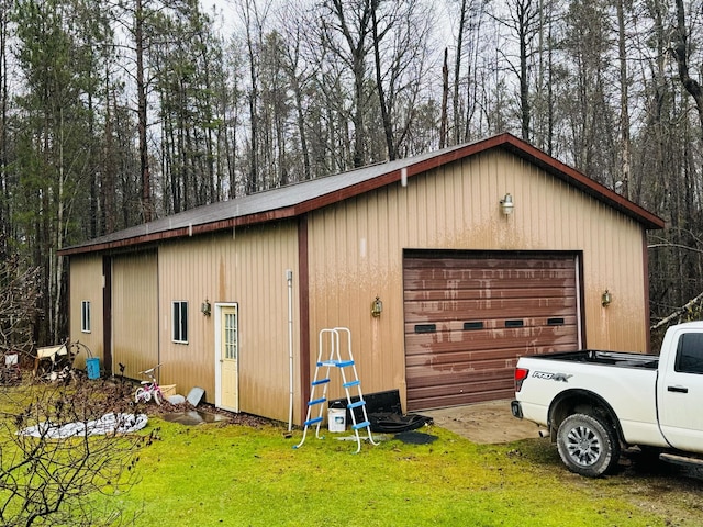 garage featuring a yard