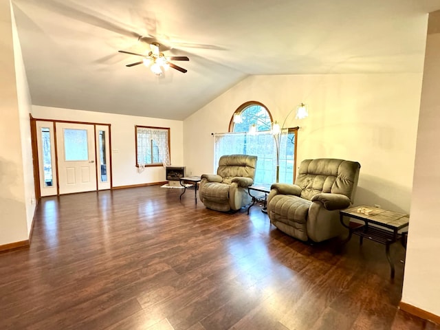 sitting room with dark hardwood / wood-style flooring, ceiling fan, plenty of natural light, and vaulted ceiling