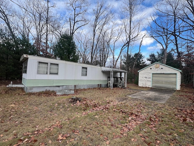 view of front facade with an outdoor structure and a garage