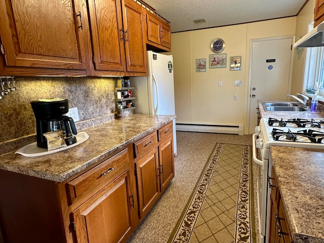 kitchen with sink, a baseboard radiator, tasteful backsplash, a textured ceiling, and white range with gas cooktop