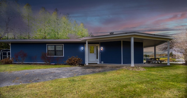 view of front of house with a yard