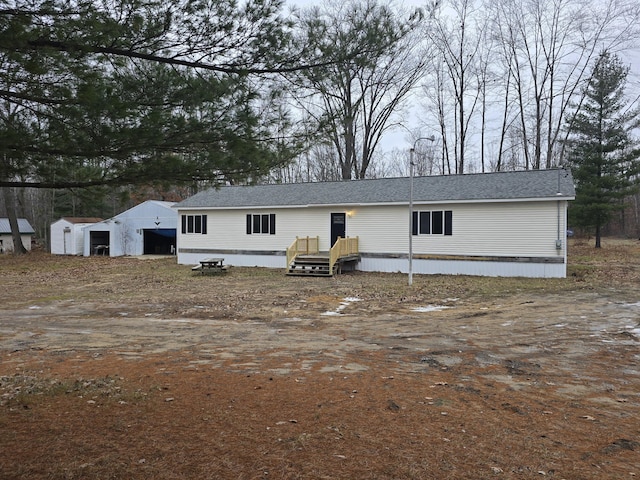 manufactured / mobile home featuring an outbuilding