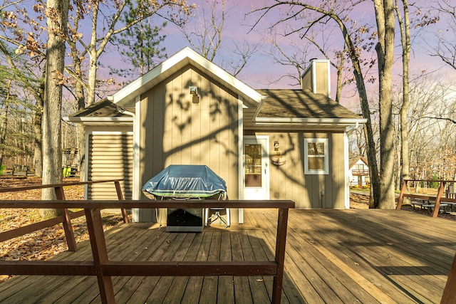 deck at dusk with a grill