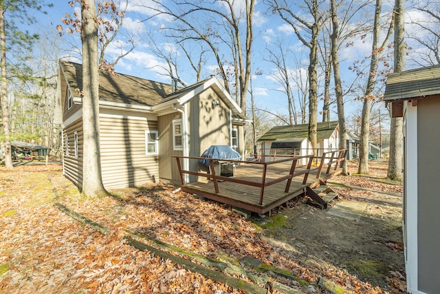 view of side of property with a wooden deck