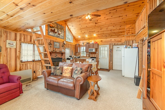 carpeted living room featuring wooden walls, wooden ceiling, ceiling fan, and lofted ceiling