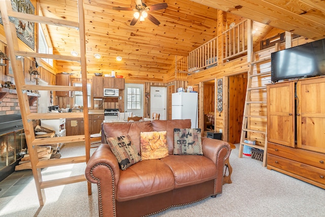 carpeted living room with wooden walls, ceiling fan, lofted ceiling, and wood ceiling