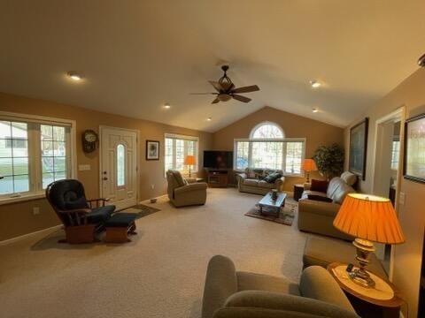 carpeted living room featuring ceiling fan and lofted ceiling